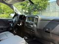 Interior view of a 2016 Chevrolet Silverado 2500HD featuring a dashboard with a touchscreen display and center console
