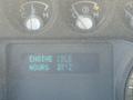 Dashboard display of a 2012 Ford F-350 SD showing the engine idle status and total hours logged of 3712