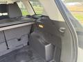 Interior view of the cargo area in a 2015 Ford Escape featuring a flat load floor and storage compartments