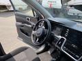 Interior view of a 2022 Kia Sorento showing the steering wheel dashboard and center console