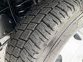 Close-up of a tire tread on a 2018 Ford Econoline showcasing detailed patterns and grooves designed for traction and stability