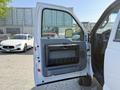 White 2015 Ford F-550 truck door open showing interior panel and controls