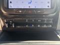 Interior control panel of a 2018 RAM 3500 featuring various buttons for climate control towing and seat heating functionalities