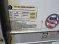 Label showing tire and loading information for a 2008 Wells Industries Inc EW1422 including specifications for cold tire pressure and spare tire information