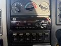 Interior control panel of a 2017 International 4300 featuring climate control knobs and a radio display showing the time and AM station