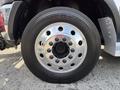 Close-up of a chrome wheel on a 2013 RAM 5500 featuring a black tire with the brand name Toyo M54 visible on the sidewall