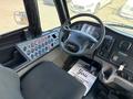 Interior view of a 2011 Freightliner B2 with a steering wheel dashboard controls and a driver's seat
