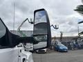 2018 Ford F-750 side mirror reflecting part of the truck and surrounding equipment