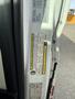 Close-up of a 2017 RAM Promaster door with vehicle information and warning labels attached to the interior frame