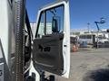 A 2008 International DuraStar truck with its driver's door open displaying the interior door panel and side mirror