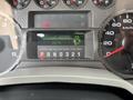 2009 Ford F-450 Super Duty dashboard displaying digital hour meter reading 2014 and gauges for speed and fuel level