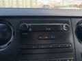 Dashboard of a 2016 Ford F-750 featuring a radio display with time showing 414 and various control buttons for audio settings
