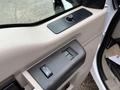 Interior view of a 2008 Ford F-350 door panel showing window control buttons and a door handle