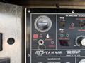 A control panel for a generator with a gauge showing hours used power switch and indicators for operation status