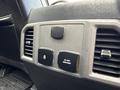Dashboard controls of a 2019 Ford F-150 featuring power outlet buttons and air vents