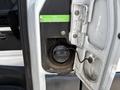 The fuel door of a 2019 Mercedes-Benz Sprinter showing a diesel fuel cap and a warning label indicating to use only specified diesel fuels