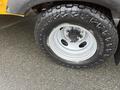 Close-up of a tire on a 2021 Ford Econoline showing a Hankook brand tire with a rugged tread design and a silver wheel rim