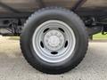 Close-up of a wheel on a 2020 Ford F-550 featuring a silver rim and a black tire with visible tread patterns