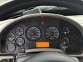 Dashboard of a 2014 International TerraStar showing various gauges for RPM, water temperature, fuel, and voltmeter along with warning lights and an LCD display