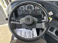 The interior view of a 2012 Autocar Xpert showcasing the steering wheel and dashboard with gauges and controls visible