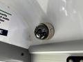 A security camera mounted on the ceiling of a vehicle with a spherical lens design