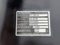 A label displaying specifications for a 2004 Bombardier SW48 including model number and vehicle weight in kilograms and pounds