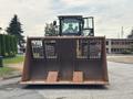 A 2012 Caterpillar 980 front-end loader with a large metal bucket and a visible operator inside the cab