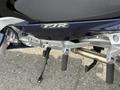 Close-up of a 2016 Yamaha FJR1300AE motorcycle's footpeg and gear shift assembly showcasing the design and build quality