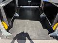 View of the interior cargo space of a 2021 Ford Transit Connect featuring empty compartments and a flat rubber floor