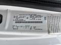 A label on a 2014 Ford E-350 detailing specifications such as weight capacity and gear ratio