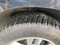 A close-up view of a tire on a 2017 Ford Edge showcasing its tread pattern and the brand name Goodyear on the sidewall