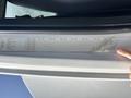 A 2014 Freightliner M2 106 door frame with a vehicle specifications label displaying various information about the truck's components and measurements