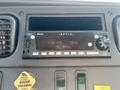 Aptiv radio display in a 2006 Freightliner M2 106 showing FM station 96.9MHz and current time 11:40 with various control buttons and knobs