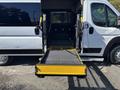 A 2020 RAM ProMaster 3500 with an extended ramp for accessibility positioned at the rear doors of the vehicle