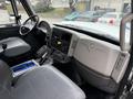Interior view of a 2013 International Workstar 7500 showing the driver's seat dashboard and controls with various buttons and a gear shift