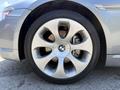 Close-up view of a silver alloy wheel from a 2004 BMW 6-Series featuring a multi-spoke design and the BMW logo at the center