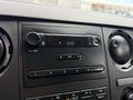 Dashboard of a 2017 Ford F-750 showing a radio display with a clock indicating 12:40 and various control buttons for audio settings