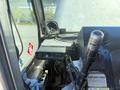 Interior view of a 2009 Workhorse W62 showing the dashboard with controls a speaker and warning labels