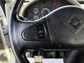 Steering wheel of a 2012 International DuraStar 4300 showing controls for cruise and throttle