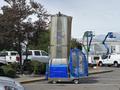 A 2023 Bitimec SC415 equipment with a transparent cylindrical shape and blue base featuring an entrance door on the side
