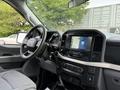 Interior view of a 2021 Ford F-150 showcasing the dashboard steering wheel and touchscreen display