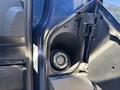 Fuel cap of a 2016 Ford Transit 150 with the cover open revealing the fuel filler neck and cap inside