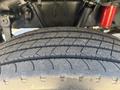 Close-up of a tire tread from a 2020 Peterbilt 330 showing distinct grooves and patterns designed for traction and stability