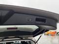 The interior view showing the rear hatch control button of a 2016 Subaru Forester