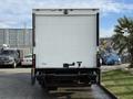 A 2014 International TerraStar truck with a white rear cargo door and a visible bumper