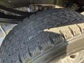 Close-up of a 2012 Ford F-350 SD tire showing detailed tread patterns and rubber texture