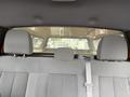 Interior view of the back seat of a 2014 Ford F-150 with gray fabric seats and headrests visible in the foreground