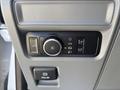 Control panel in a 2021 Ford F-150 featuring knobs and buttons for headlights fog lights and a pull switch