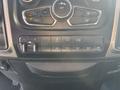 Dashboard controls of a 2014 RAM 5500 with buttons for A/C, tow/haul options, auxiliary input, and power take-off settings