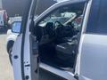A 2019 Ford F-150 interior showing the driver's seat and dashboard with the door open